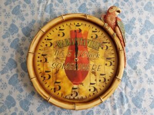 Clock indicating Margaritaville - It's 5 O'Clock SOMEWHERE on it with all hours indicating 5 on them instead of 1 through 12